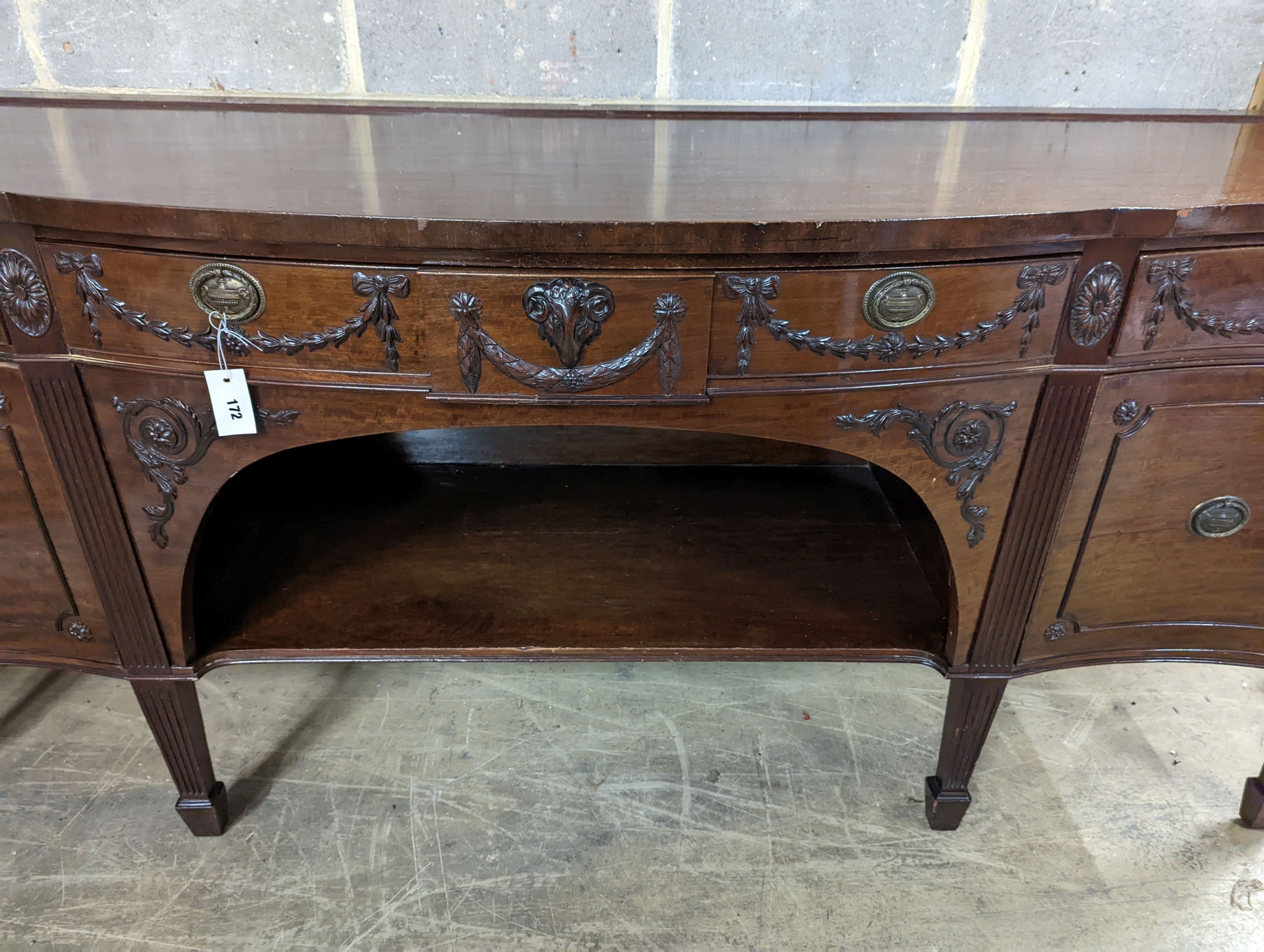 An early 20th century Adam design mahogany serpentine sideboard, length 214cm, depth 68cm, height 92cm